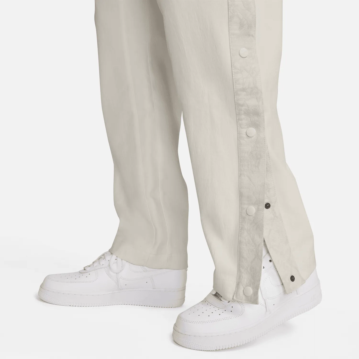 Sure! Here’s an optimized title for the product:

Nike Devin Booker Tear-Away Pants in Pale Ivory - Stylish & Functional Athleisure Wear