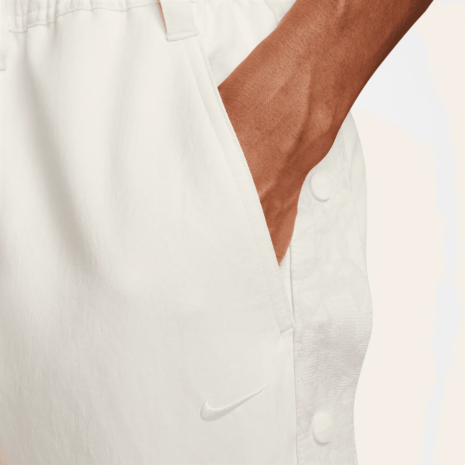 Sure! Here’s an optimized title for the product:

Nike Devin Booker Tear-Away Pants in Pale Ivory - Stylish & Functional Athleisure Wear