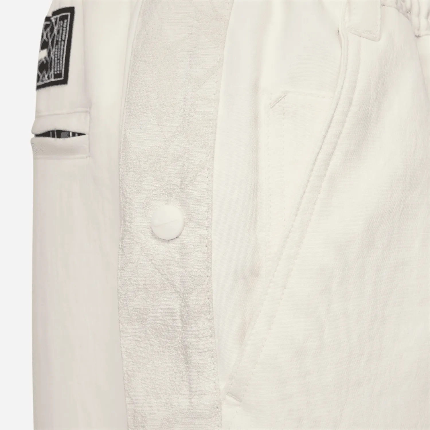 Sure! Here’s an optimized title for the product:

Nike Devin Booker Tear-Away Pants in Pale Ivory - Stylish & Functional Athleisure Wear