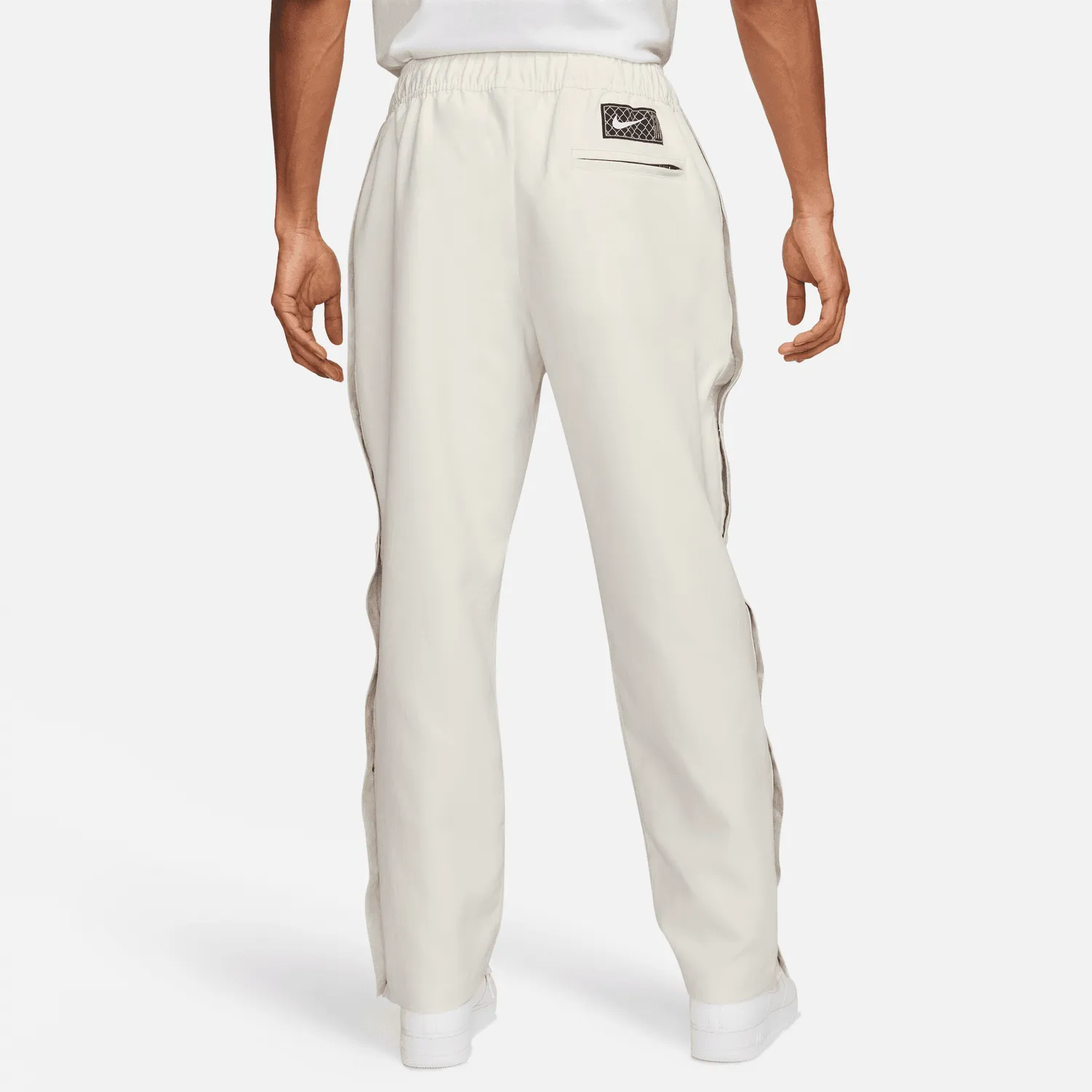 Sure! Here’s an optimized title for the product:

Nike Devin Booker Tear-Away Pants in Pale Ivory - Stylish & Functional Athleisure Wear